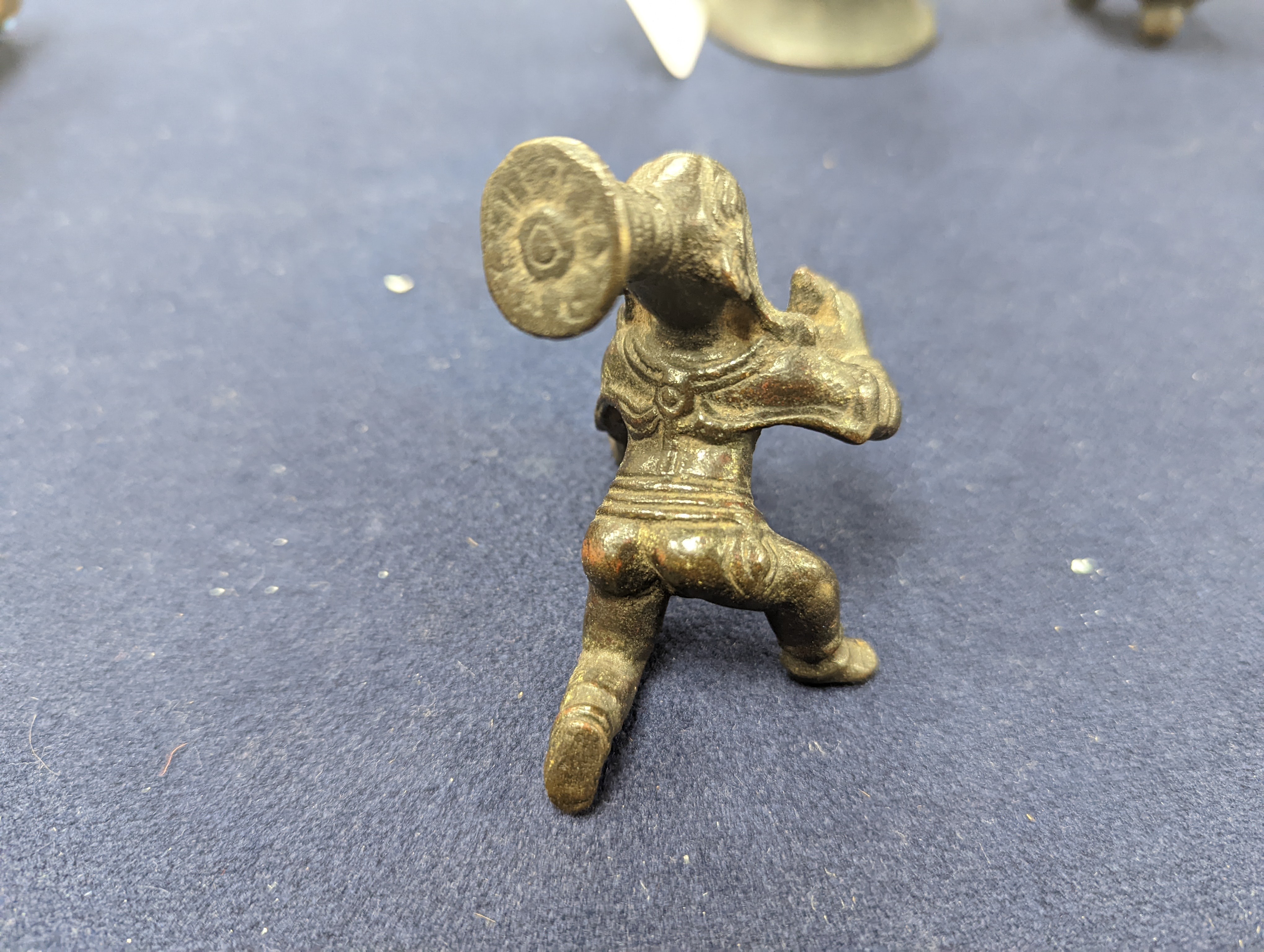 A Chinese gilt copper figure, a Chinese Dog of Fo, a bell, a censer, six Indian bronze figures and a scroll box
